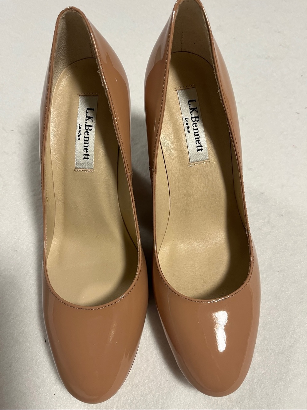 LK Bennett Patent Leather Wedge in Nude Tan
Size 36
New without Tags